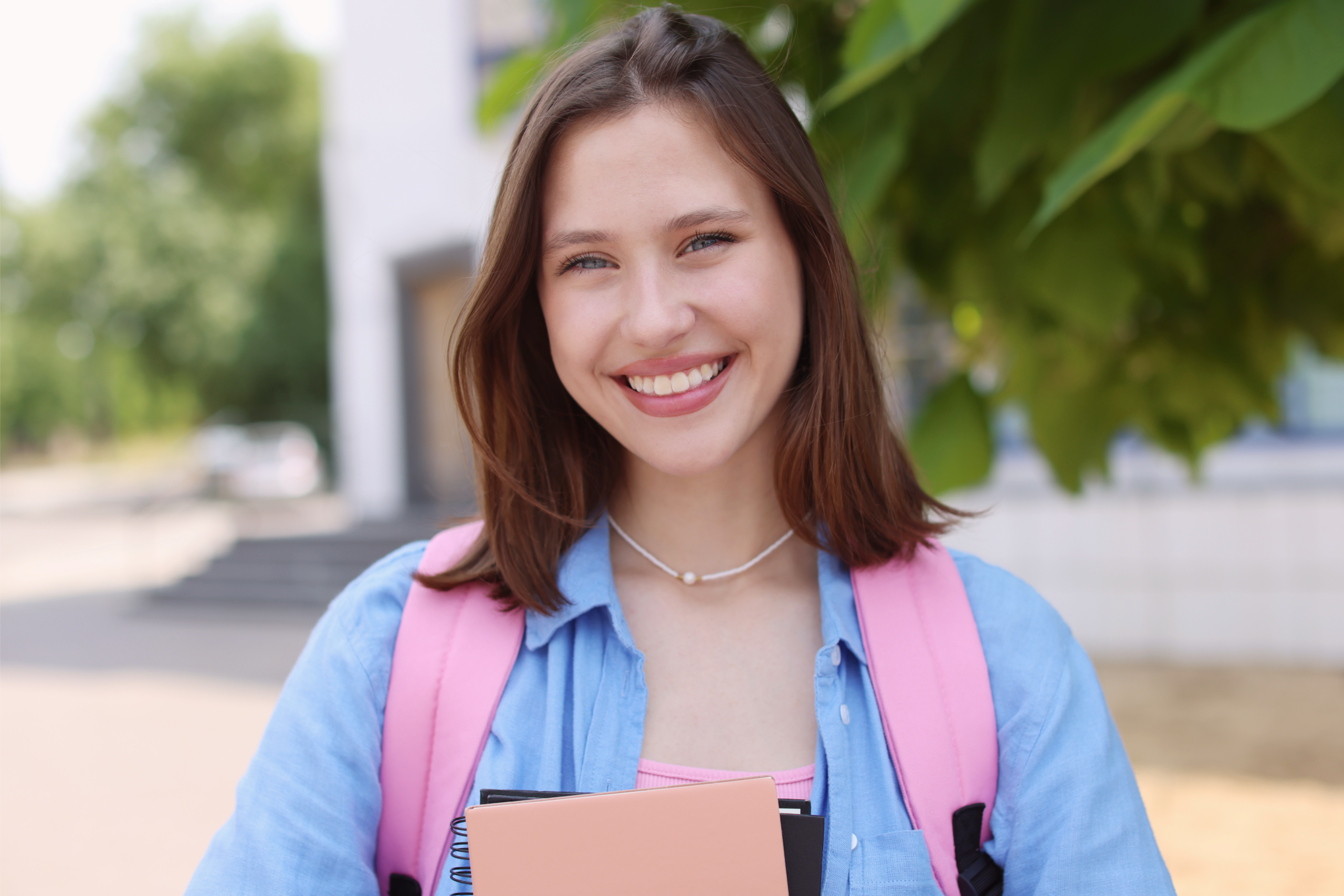 Teen smiling with backpack
