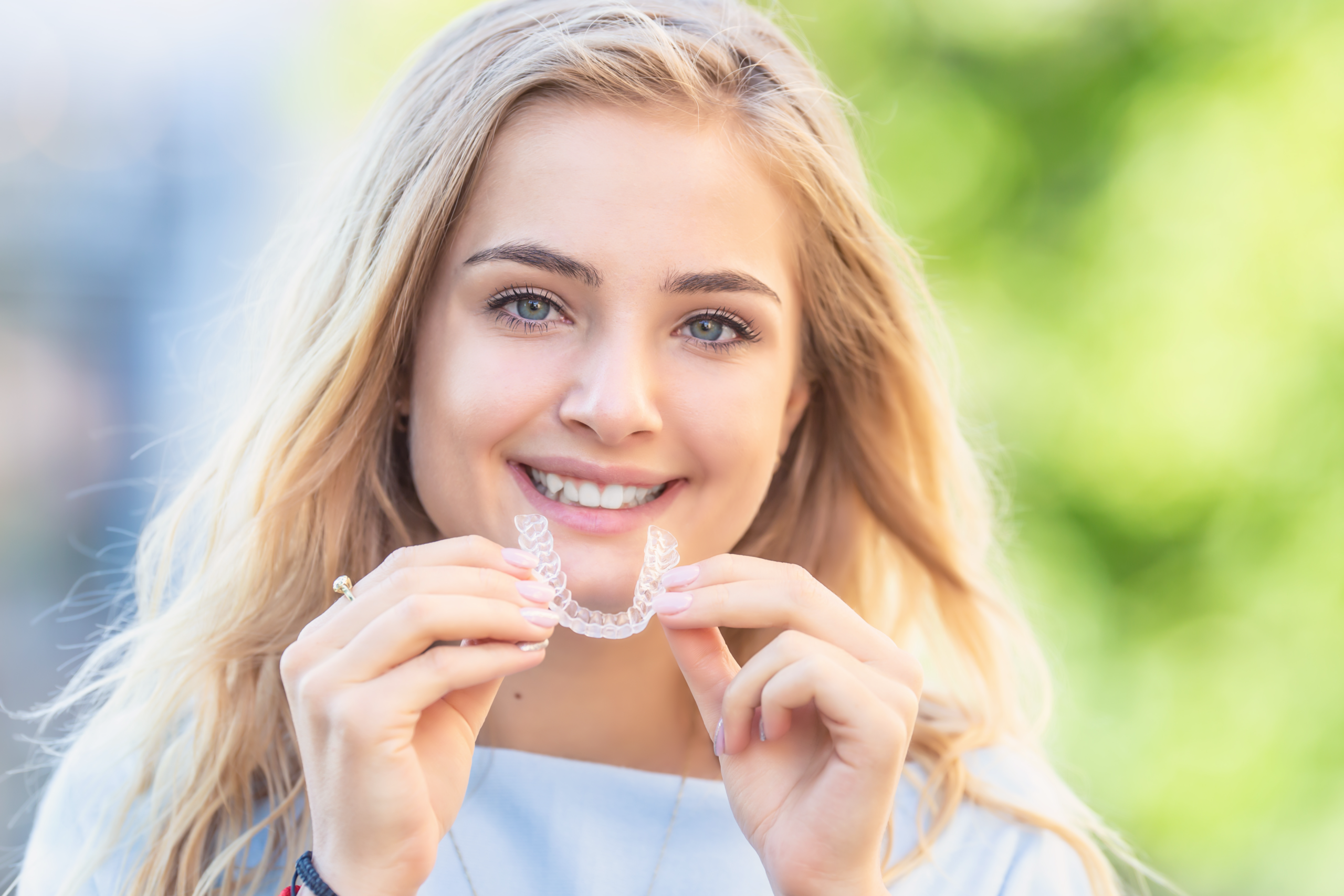 Teen woman with aligners